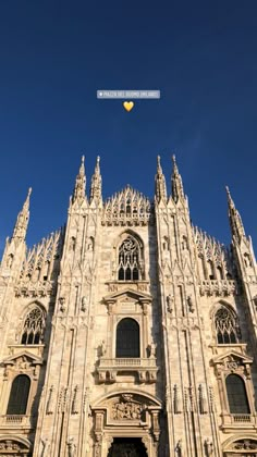 an image of a very tall building that looks like it is in the air