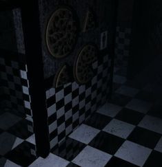 a black and white checkered floor in a dark room