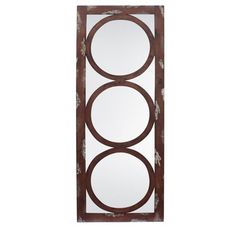 a mirror that is hanging on the side of a wall in front of a white background