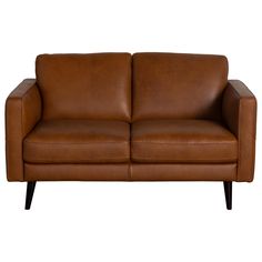 a brown leather couch sitting on top of a wooden frame