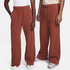 Keep your look elevated when temperatures drop. With added length and extra-plush high-loft fleece, these pants are loungewear you'll want to wear everywhere. Nike Solid Color Loungewear Pants, Nike Comfortable Joggers For Loungewear, Relaxed Fit Nike Joggers For Loungewear, Nike Full Length Sweatpants For Loungewear, Nike Full-length Athleisure Sweatpants, Nike Relaxed Fit Pants With Straight Hem, Nike Sports Bottoms For Fall, Nike Sporty Sweatpants For Fall, Nike Full Length Athleisure Sweatpants