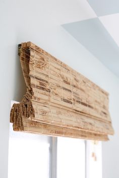 a close up of a window sill made out of bamboo