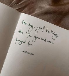 an open book with a handwritten poem on it's cover and the words one day you'll be living the life you had once forgot for