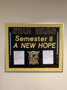 a star wars poster hanging on the wall