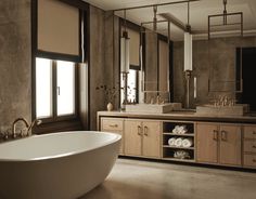 a bath room with a large tub and a sink