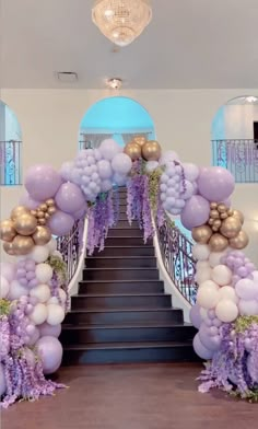 a staircase decorated with balloons and flowers