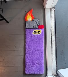 a towel hanging on the wall next to a fire extinguisher's door