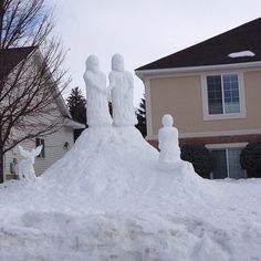 some snow sculptures in front of a house