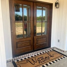 a welcome mat on the front door of a house