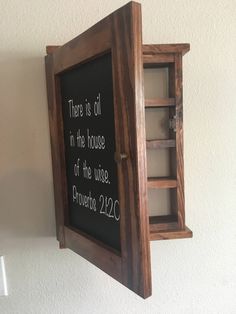 "FREE SHIPPING in the USA This essential oil cabinet has 4 shelves and can hold over 100 5 ml bottles. The door painted in a chalkboard paint, allows you to store your oils in the dark. The shelf has a magnetic closure to keep the door securely closed. The shelf measures 18\" x 13\" x 4\" The shelf can be wall hung or placed on a flat surface. We also have several other color finishes to choose from in our ETSY shop. Each case is completed with your color choice and a clear coat. This unit is sh Wooden Essential Oil Holder, Storing Essential Oils, Diy Essential Oil Holder, Essential Oil Cabinet, Essential Oil Organization Storage, Essential Oil Display Ideas, Essential Oils Storage Ideas, Essential Oil Storage Ideas, Essential Oil Rack