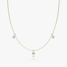 The Floating Station Necklace features a series of ¼ carat Round Brilliant VRAI created diamonds that gently dangle from their pierced-diamond settings. Jewellery Showroom, Floating Necklace, Bespoke Rings, Diamond Settings, Station Necklace, Three Stone, A Series, Necklace Designs, Round Brilliant