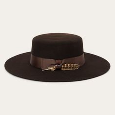 This western-inspired fashion hat makes a statement with its bold silhouette and bohemian style details. It has a 4 1/4" flat open crown, 3 1/2" flat brim, grosgrain band, silver-tone arrow hat pin and removable feather detail. Handmade in the U.S.A. with a firm finish from high-quality wool felt, it’s unlined and finished with a cloth sweatband for all-day comfort. 4 1/4" Flat Open Crown 3 1/2" Flat Brim Grosgrain Hat Band Silver-Tone Arrow Hat Pin Cloth Sweatband Unlined Firm Finish 100% Wool Brogues Style, Flat Brim Hat, Denim Boots, Crown Hat, Mini Shirt Dress, Brim Hat, Hat Shop, Hat Pins, Hat Band