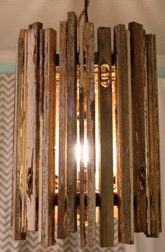 a wooden chandelier hanging from a ceiling