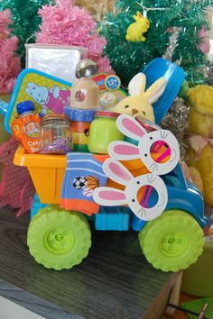 an easter basket filled with toys on top of a table