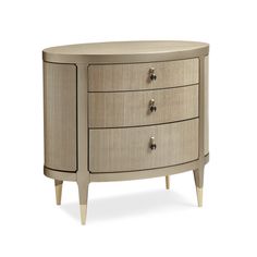 an oval shaped cabinet with three drawers on one side and two smaller drawers on the other