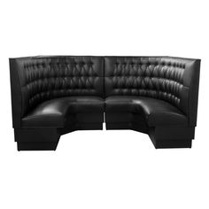 a black leather sectional sofa with rounded backrests