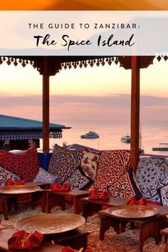 the guide to zanibar, the spice island is full of colorful cushions and tables