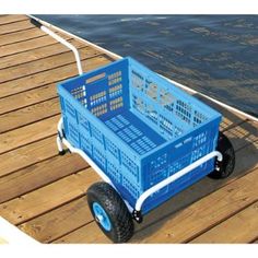 a blue wagon with wheels on a wooden dock