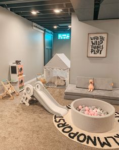 a play room with toys and decor in it