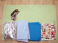 sewing supplies laid out on top of a cutting mat