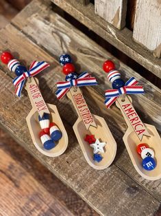 three wooden spoons with patriotic decorations on them