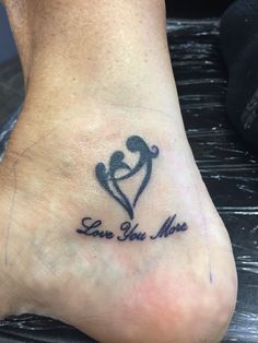 a foot with a tattoo that says love you more