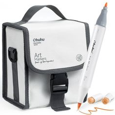 a white bag with an orange marker next to it and two other items in front of it