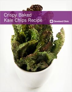 crispy baked kale chips recipe in a white bowl on a purple and white background