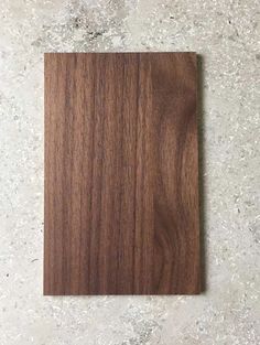 a piece of wood sitting on top of a white counter