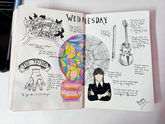 an open notebook with drawings on it