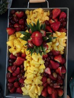 a tray filled with lots of different types of fruit