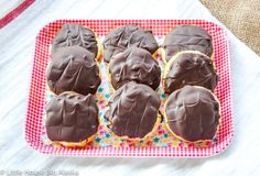 chocolate frosted cookies in a pink and white tray