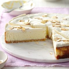 a white cake with slices missing from it