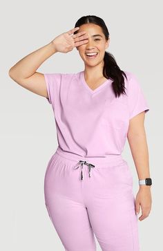 Scrub Top in Lilac - Walker Drop Shoulder 2-Pocket | DOLAN Stylish Scrubs, Doctor Scrubs, Scrub Style, Scrubs Outfit, Scrubs Uniform, Scrubs Nursing, Womens Scrubs, Medical Scrubs, Sleeves Clothing