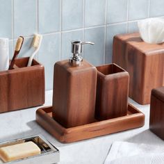 bathroom accessories including soap dispenser, toothbrush holder and tissue dispenser