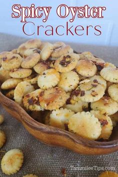 a wooden bowl filled with crackers on top of a table