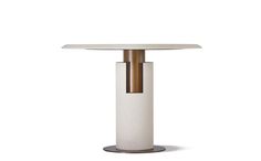 a white table with gold accents and a round glass top on an aluminum base, against a white background