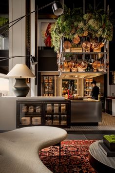 a magazine cover with an image of a kitchen and dining area in the background, surrounded by potted plants