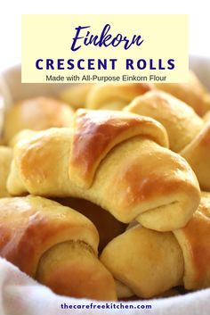 a bowl filled with rolls sitting on top of a table