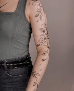 a woman with a tattoo on her arm