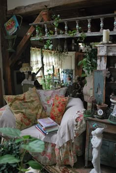 a living room filled with furniture and lots of plants