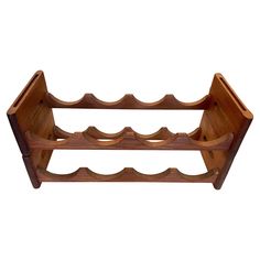 a wooden wine rack is shown against a white background