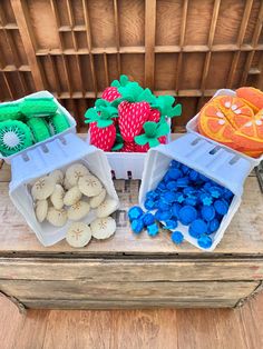 three plastic containers filled with different fruits and vegetables