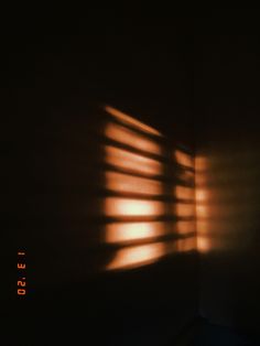 the light is shining through the blinds in the room