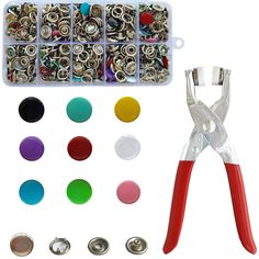 a pair of pliers, buttons and other crafting supplies