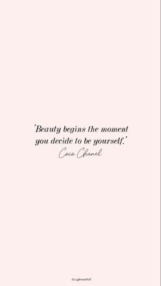 a pink wall with a quote on it that says beauty begins the moment you decide to be yourself