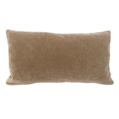 a brown pillow on a white background