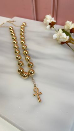 Inspire your style and express your faith with our "Eternal Grace Cross Pendant Necklace." This stunning necklace features a beautifully crafted cross pendant adorned with intricate gold beads and sparkling zircon accents. 𝐌𝐀𝐓𝐄𝐑𝐈𝐀𝐋: 18k Gold filled 𝐂𝐀𝐑𝐄 𝐓𝐈𝐏𝐒: Avoid contact with moisture (water, perfume and other chemicals) Mostly take off jewelry when exercising, showering, sleeping When not in use store your pieces in the jewelry bag or box. Water Perfume, Jewelry Bag, Cross Pendant Necklace, Stunning Necklace, Jewelry Bags, Care Tips, Gold Beads, Cross Pendant, Chemicals