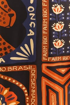 an orange and blue scarf with designs on it that say no brasii deshanosa