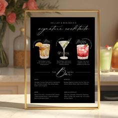 a menu for cocktails on a table with flowers in the background